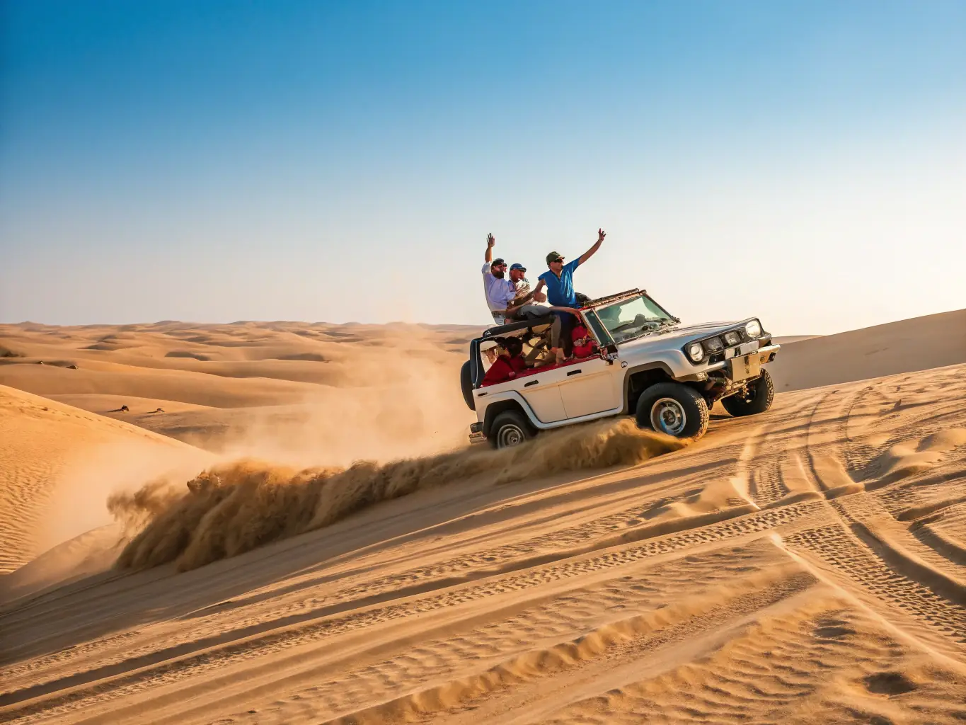 A wide shot of a luxury SUV navigating the rolling sand dunes of the Sharjah desert at sunset, with a small group of people enjoying a private desert safari.