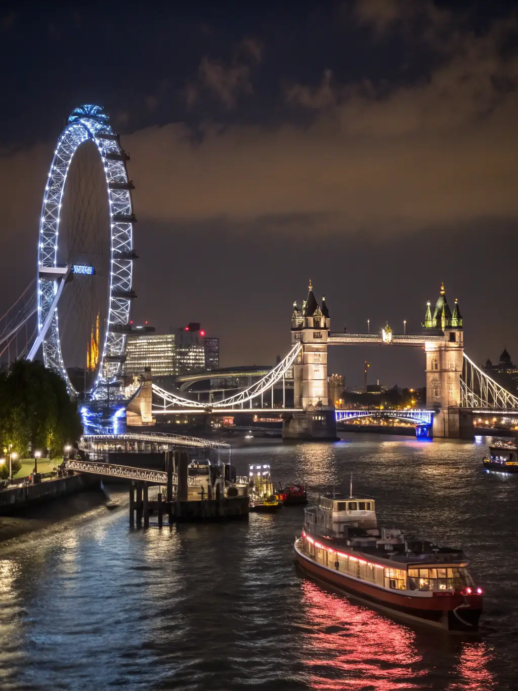 An iconic shot of the London skyline, featuring landmarks like the Tower Bridge and the Shard, symbolizing prestige and elegance.